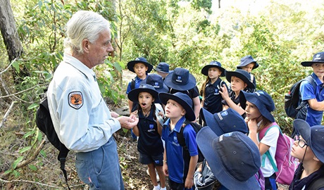 An Aboriginal guide with a group of students on an Aboriginal culture school excursion in Hunter Wetlands National Park. Photo: Adam Hollingworth © DPIE