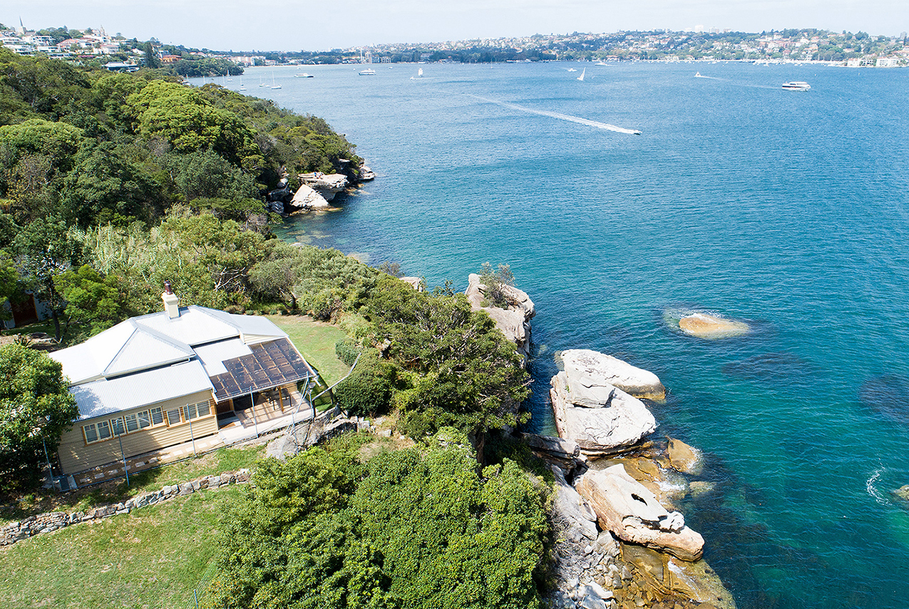 An aerial view of Steel Point Cottage with Sydney Harbour and Sydney City views in the background. Credit: Gareth Pickford © DCCEEW